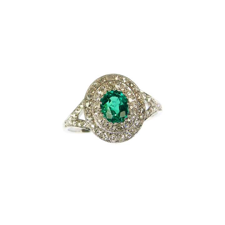 Early 20th century emerald and diamond cluster ring